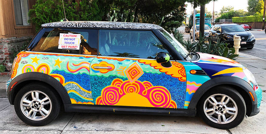 A colorful Mini Cooper painted.